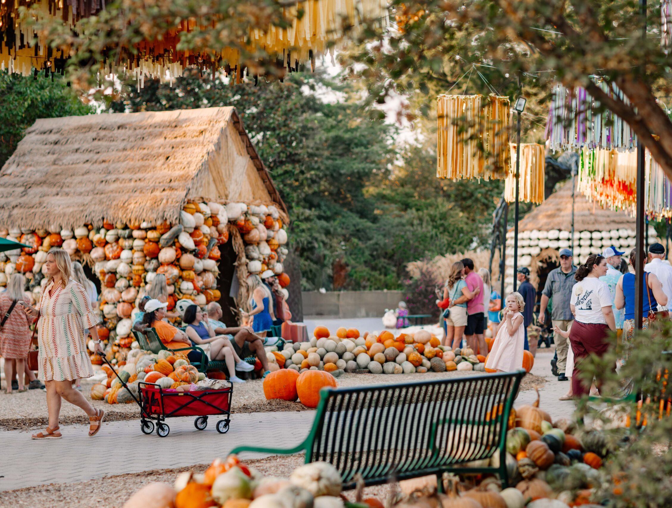 Dallas Arboretum guests walking through the Pumpkin Village.